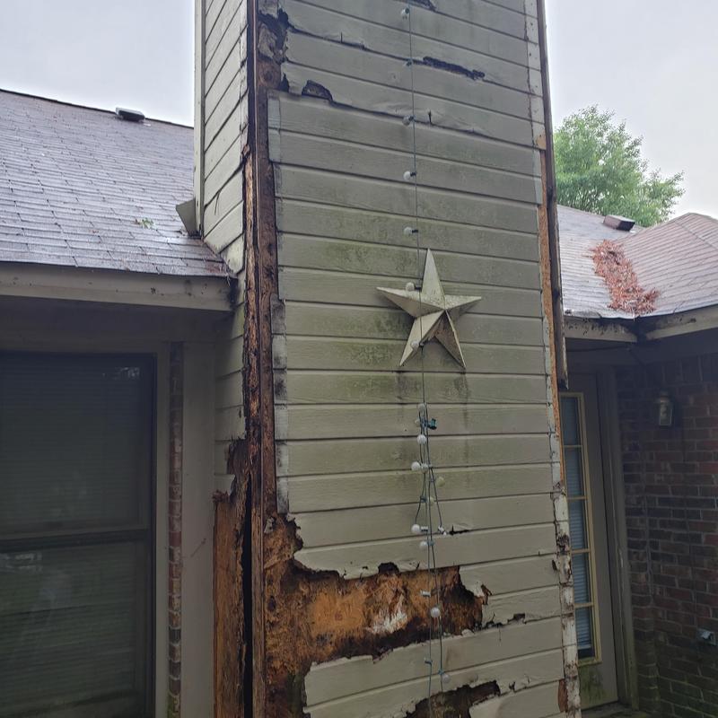 Chimney wood siding with extensive water damage