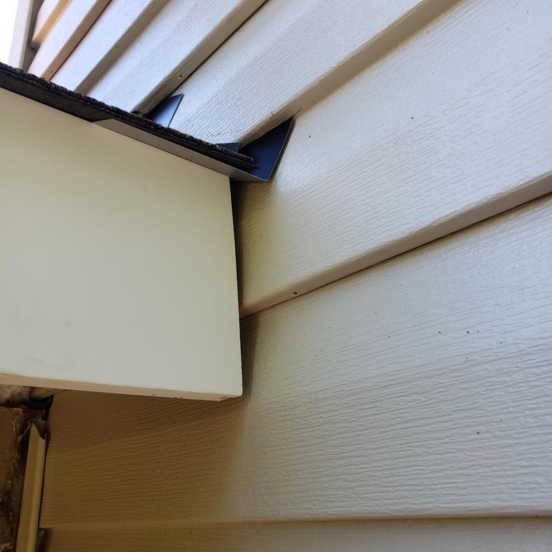 Roof edge flashing installation on wood siding panel