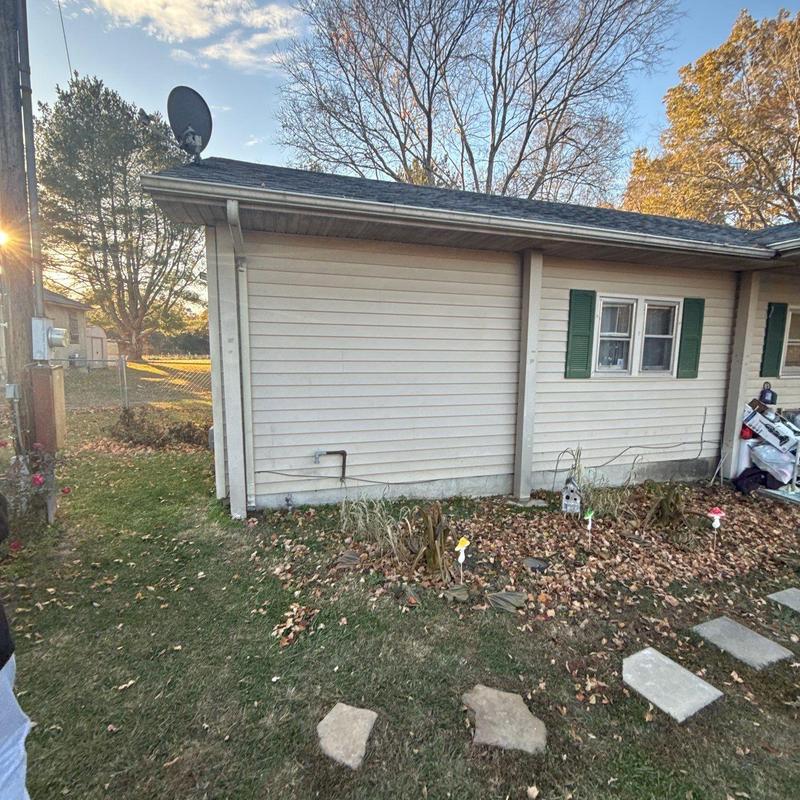 Satellite dish and roof shingles inspection in yard