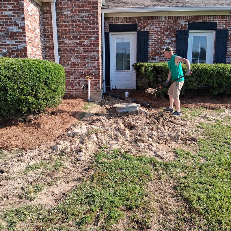 Plumbing excavation site with sod grass replacement