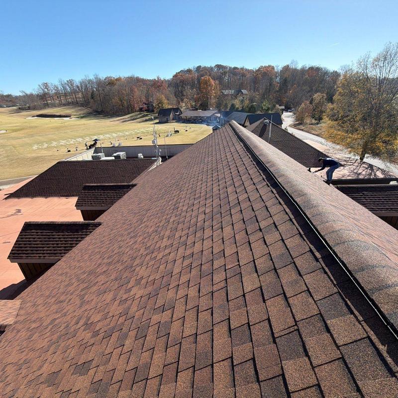 Asphalt shingle roof inspection with ridge caps and flashing