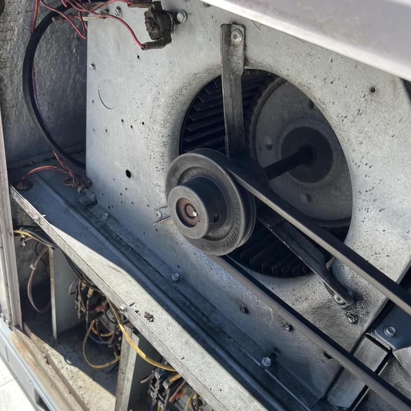 Blower assembly and belt inside HVAC unit