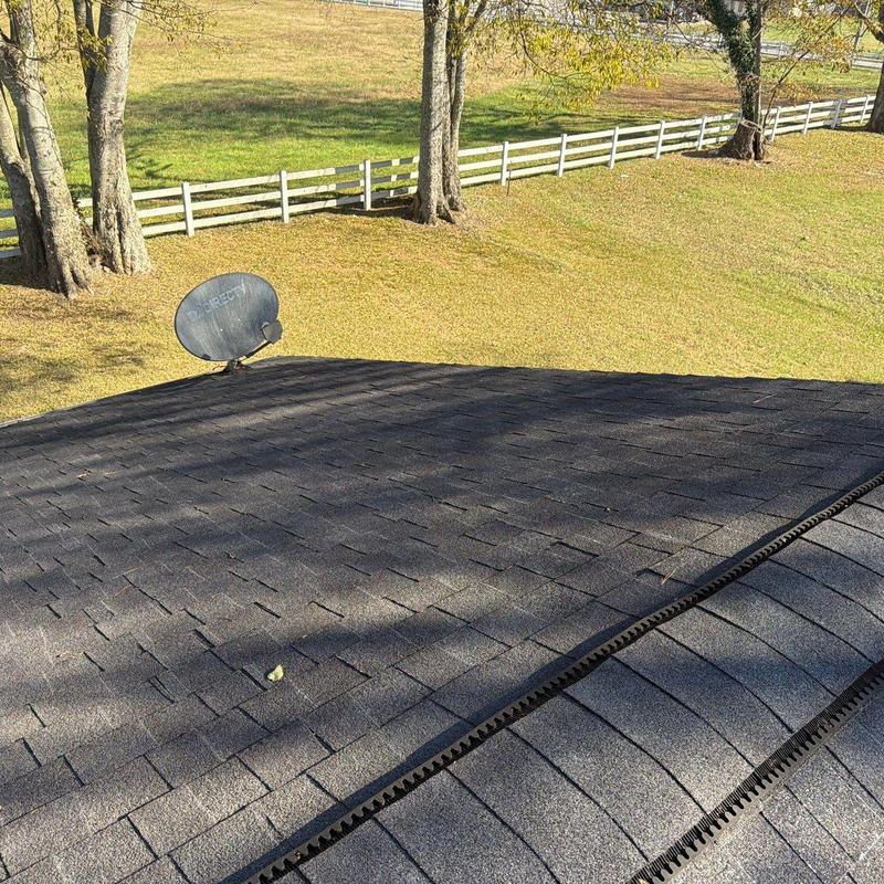 Asphalt shingle roof with ridge vents and satellite dish
