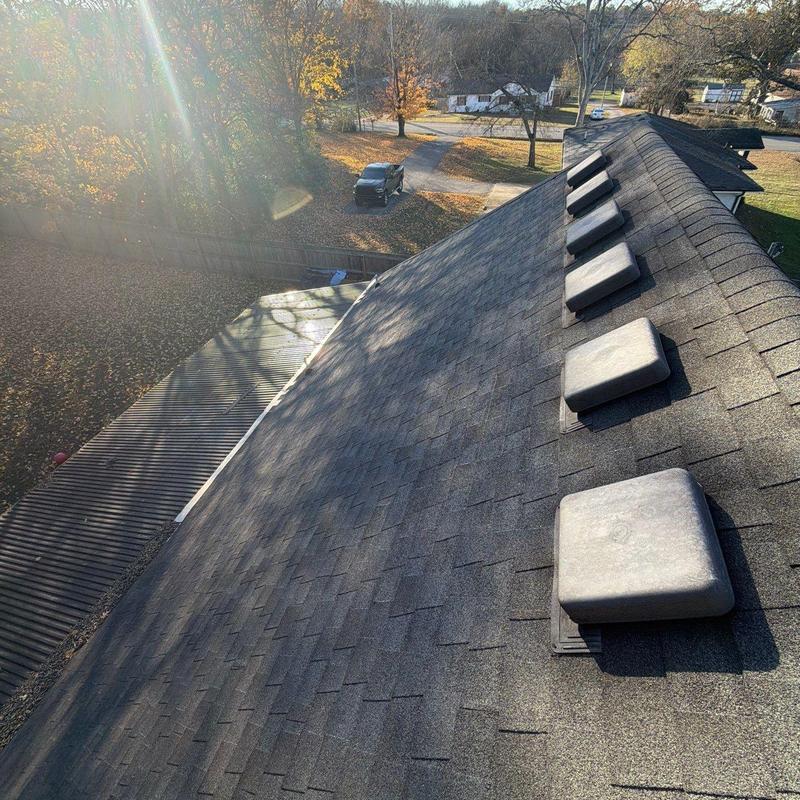 Roof shingles with vents and sunlight glare