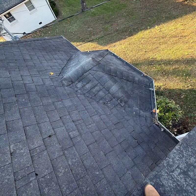 Roof shingles with hail damage and ridge cap wear