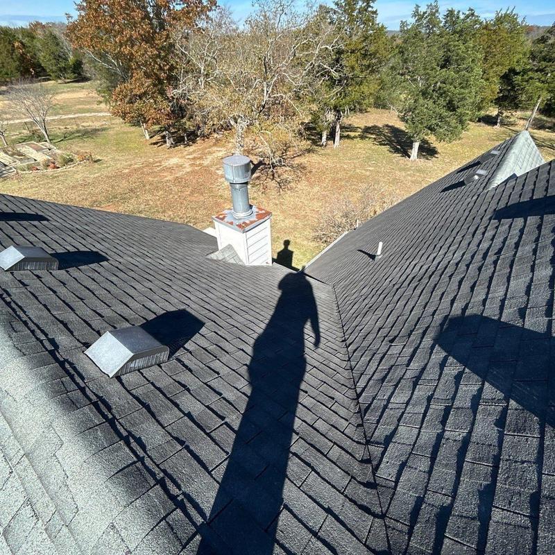 Asphalt shingle roof with vents and chimney stack