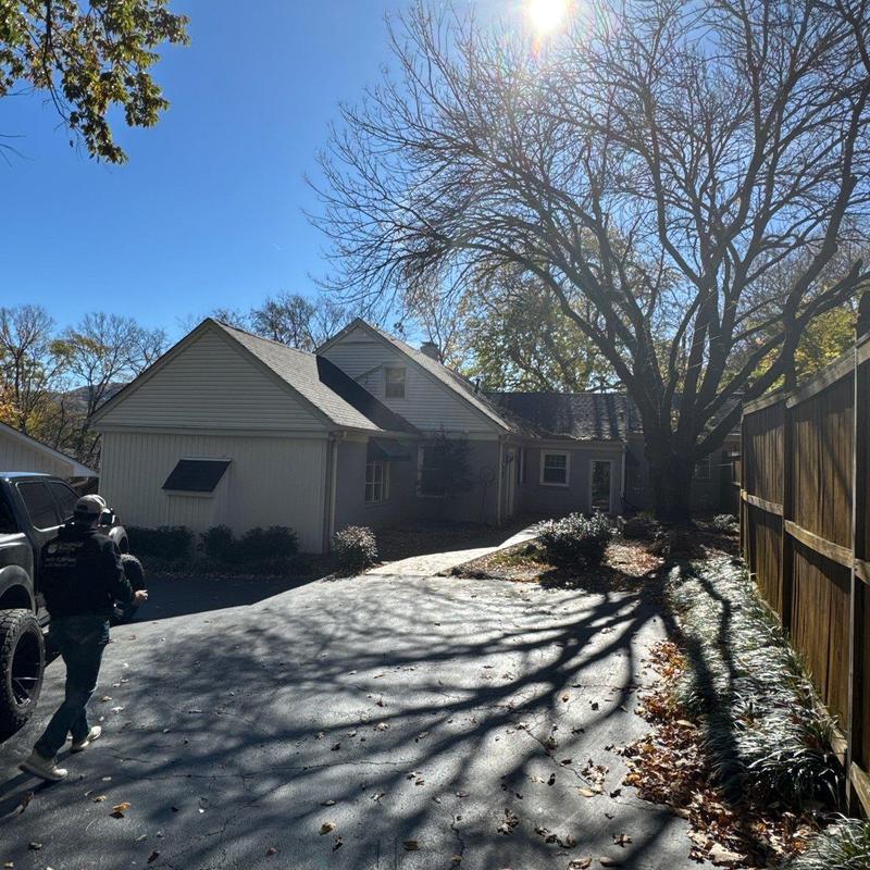 Asphalt shingle roof with hail damage inspection