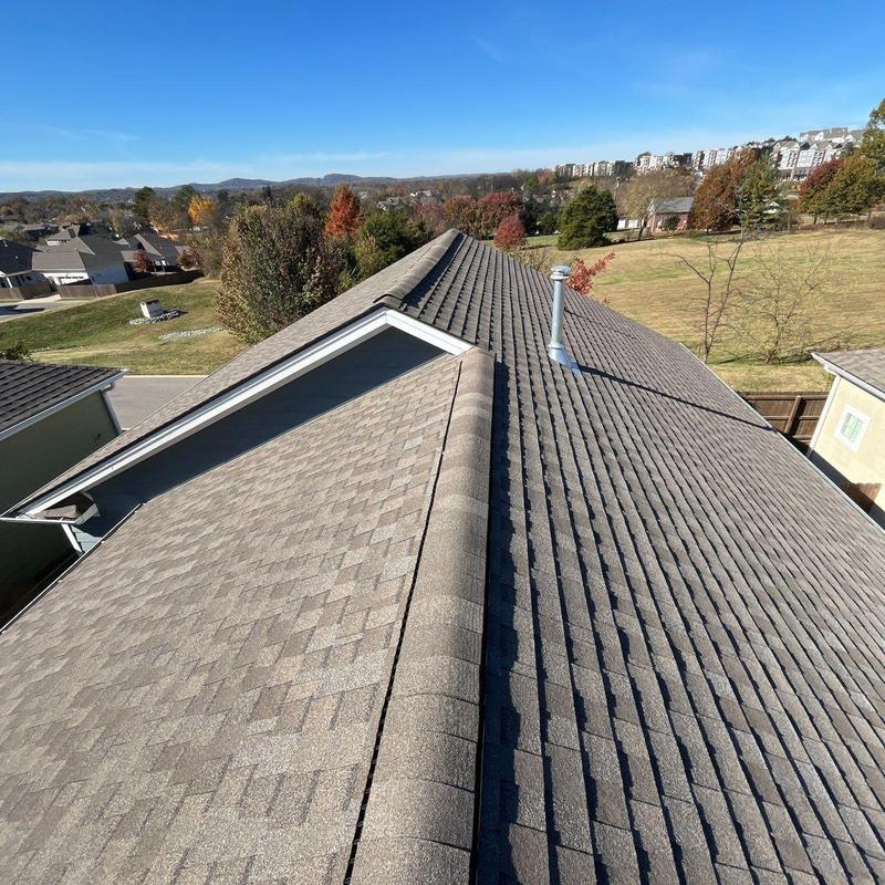 Asphalt shingle roof with ridge vent inspection