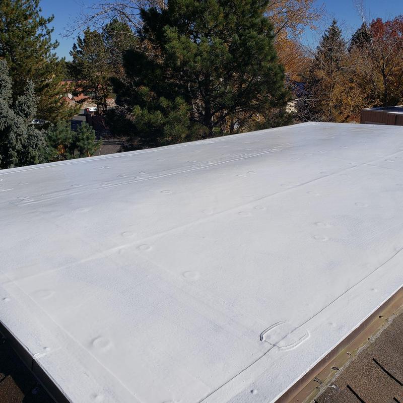 Modified flat roof with white silicone coating Modified flat roof with white silicone coating