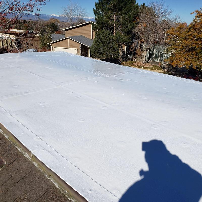 Modified flat roof with white silicone coating Modified flat roof with white silicone coating