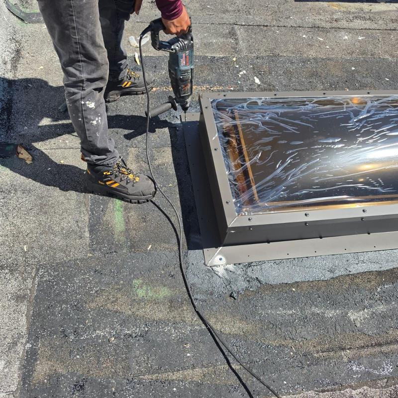 Skylight frame installation on flat roof surface Skylight frame installation on flat roof surface