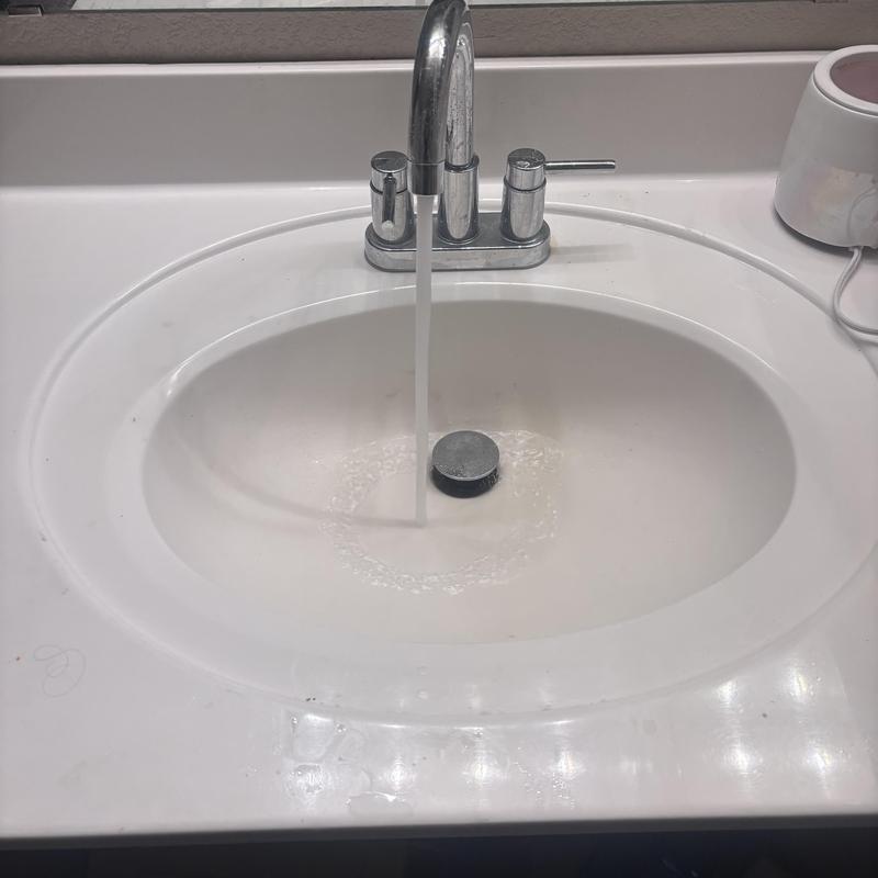 Bathroom sink drain cleaning with running faucet Bathroom sink drain cleaning with running faucet
