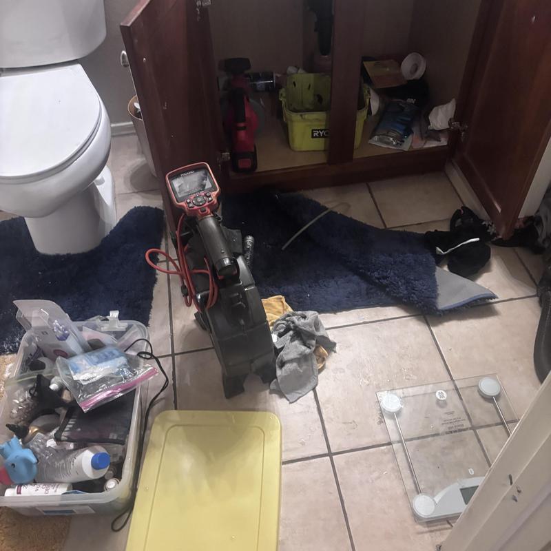 Drain line cleaning with inspection camera in bathroom Drain line cleaning with inspection camera in bathroom