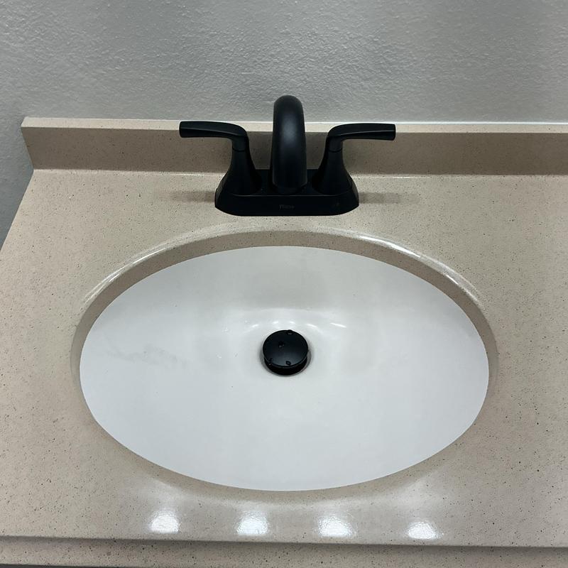 Lav faucet and sink installation on beige countertop