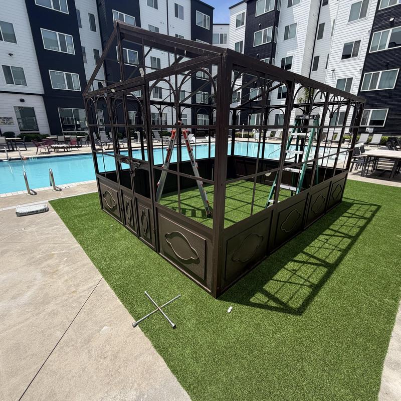 Artificial turf installation around metal gazebo frame Artificial turf installation around metal gazebo frame
