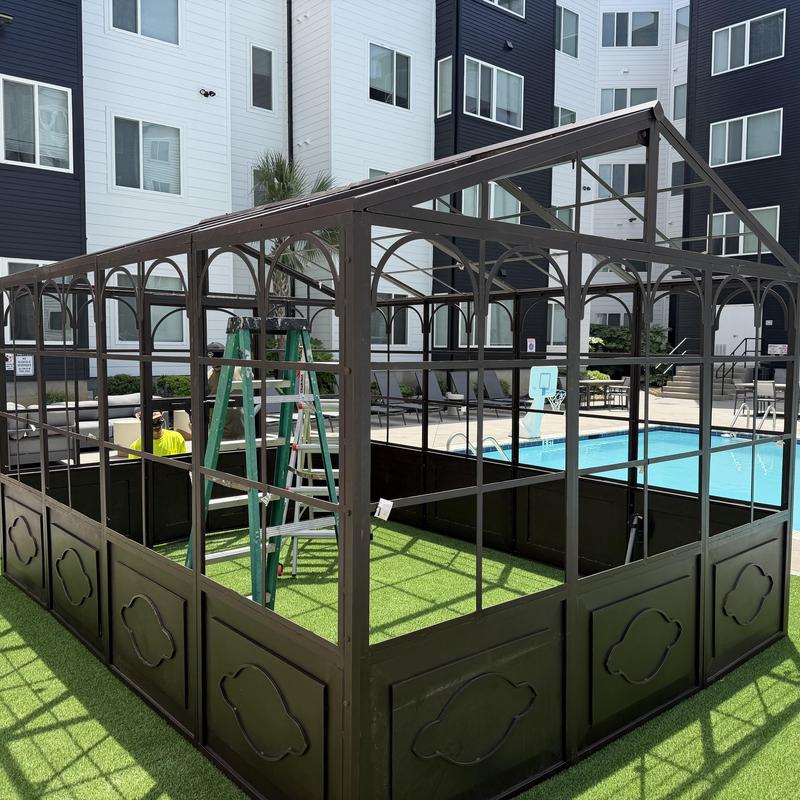 Metal gazebo frame with artificial turf and ladders Metal gazebo frame with artificial turf and ladders