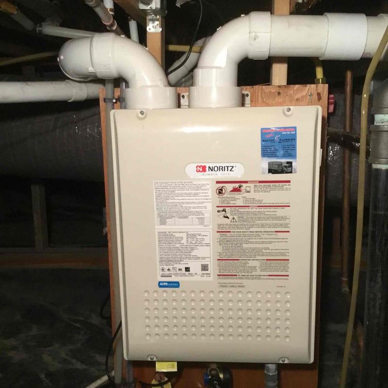 Tankless water heater with vent pipes in basement Tankless water heater with vent pipes in basement