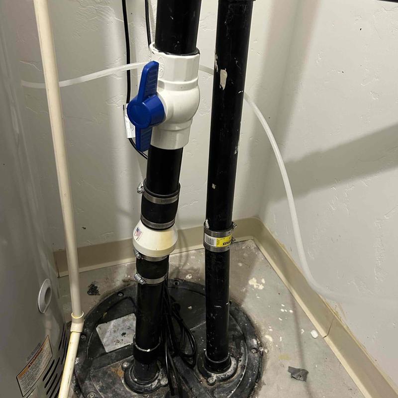 Sewage ejection pump system in basement utility room