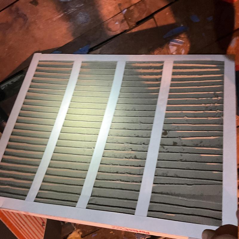 HVAC air filter heavily coated with dust dirt HVAC air filter heavily coated with dust dirt