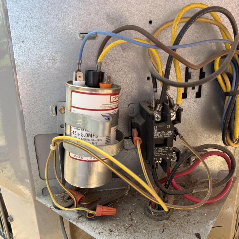 Air conditioner capacitor and relay with wiring connections Air conditioner capacitor and relay with wiring connections