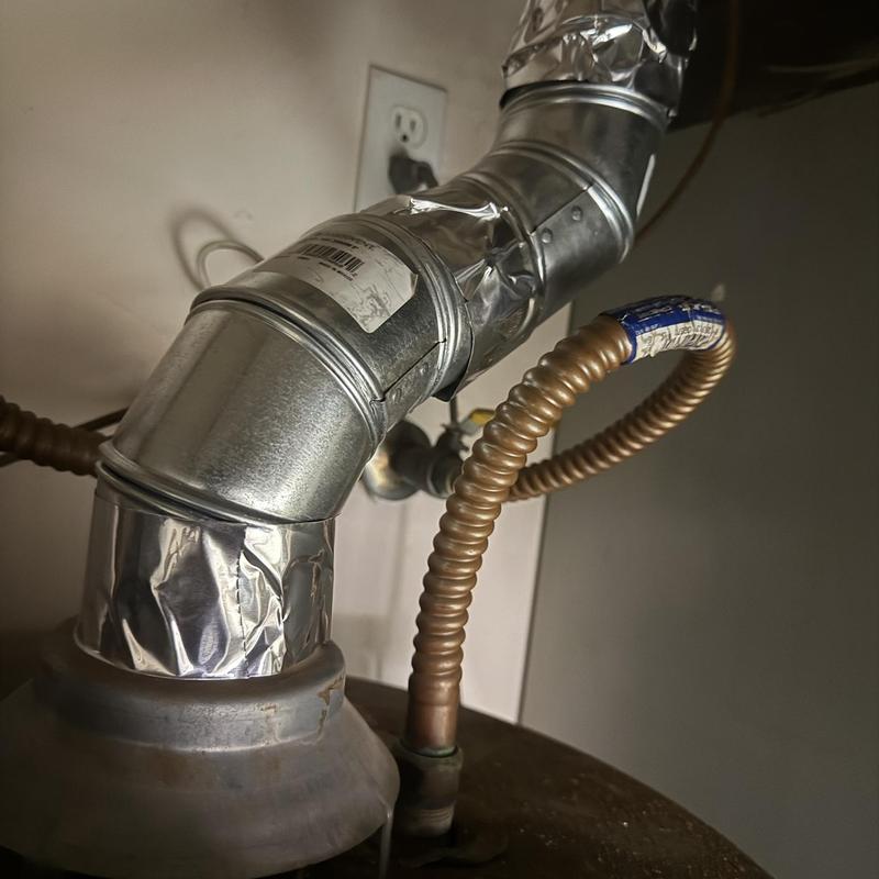 Flue vent pipe and flexible gas line connection Flue vent pipe and flexible gas line connection