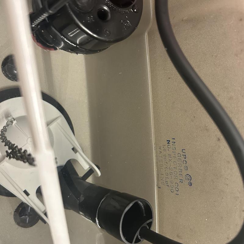 Toilet fill valve and flapper mechanism inside tank