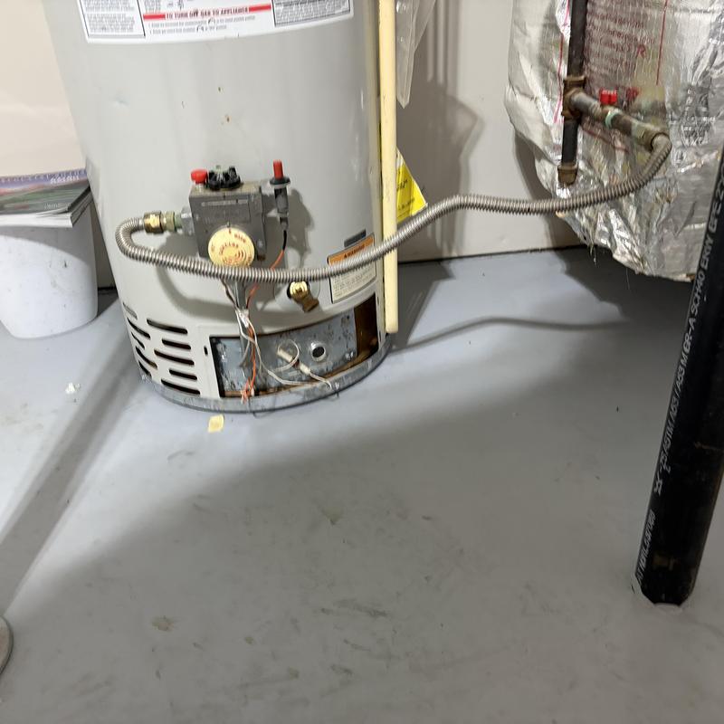Water heater pilot light and thermocouple assembly