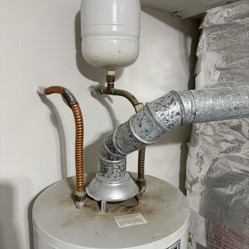 Water heater with pilot light and vent pipe system
