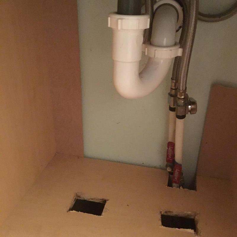 Vanity water lines routed through base with shutoff valves