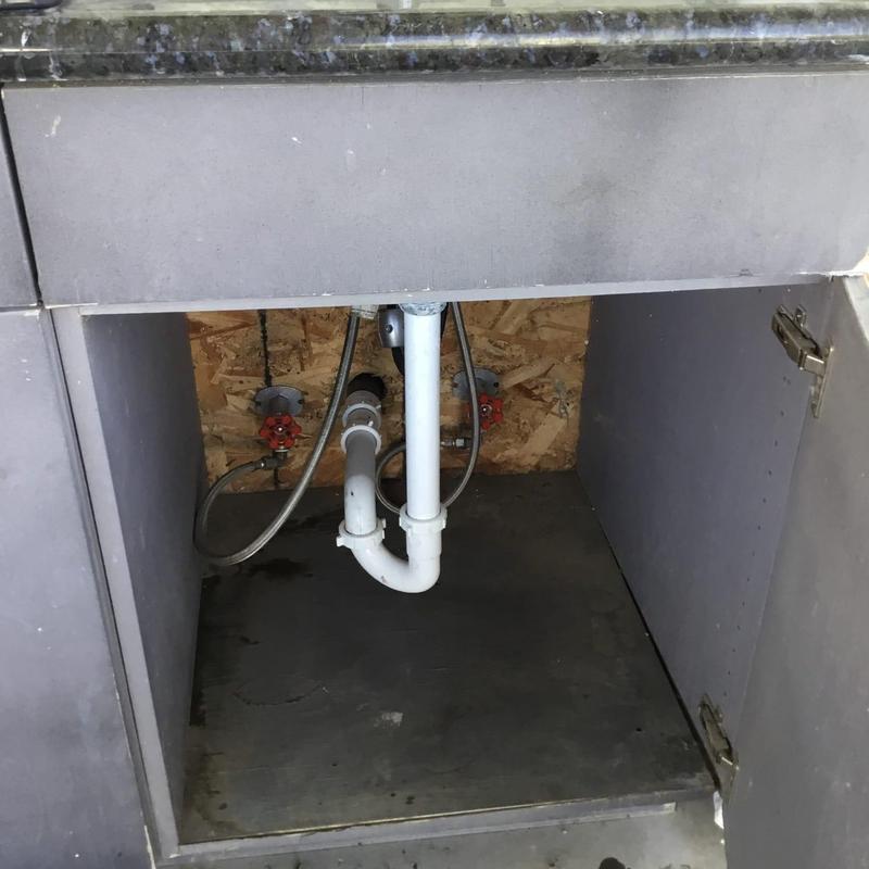 Kitchen drain pipe under sink with valves and connections Kitchen drain pipe under sink with valves and connections