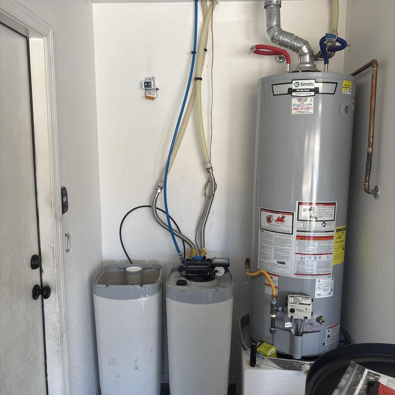 Water softener system with water heater and supply lines Water softener system with water heater and supply lines