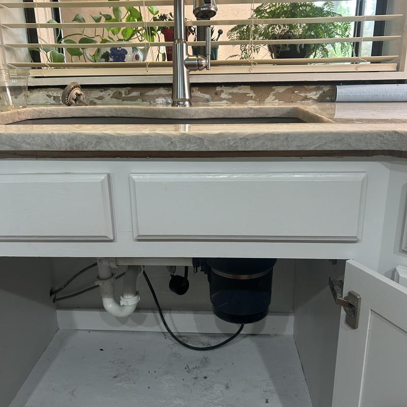 Kitchen faucet and garbage disposal installation under sink Kitchen faucet and garbage disposal installation under sink