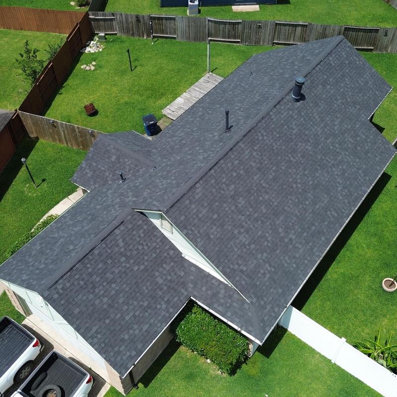 Owens Corning Onyx black shingle roof with black gutters