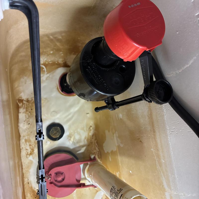 Toilet fill valve and flapper installed inside tank Toilet fill valve and flapper installed inside tank