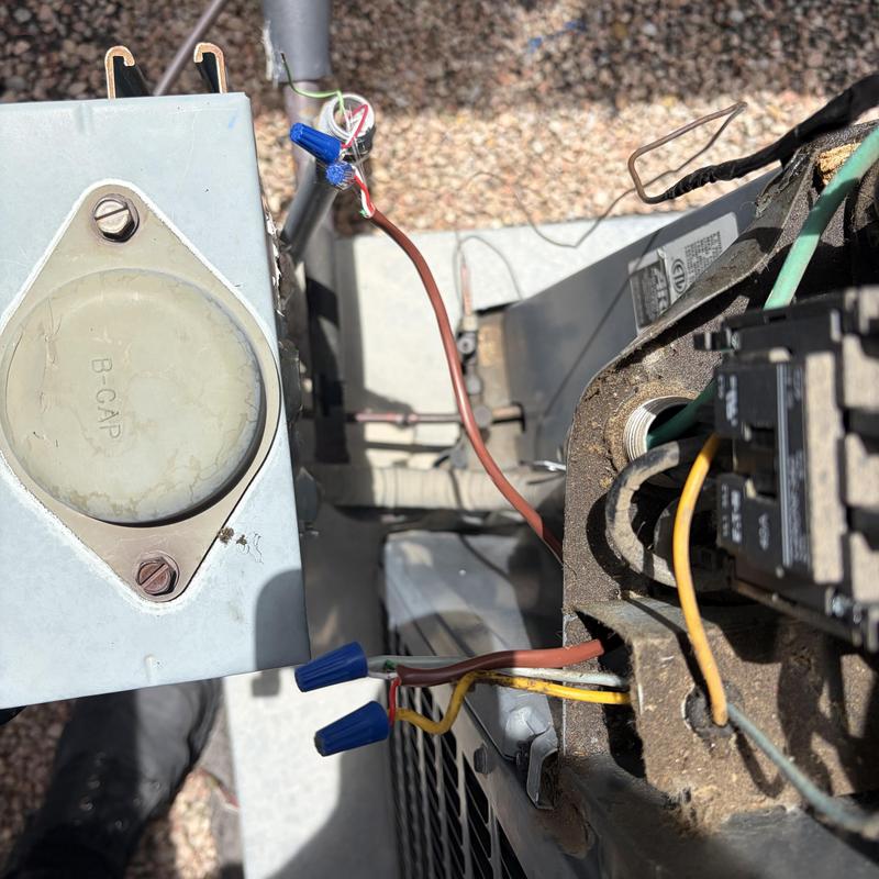 Capacitor wiring on outdoor HVAC unit panel