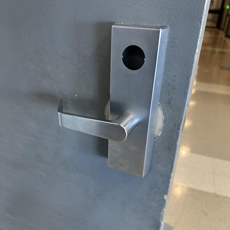 Commercial exit device lever handle with lock cylinder hole