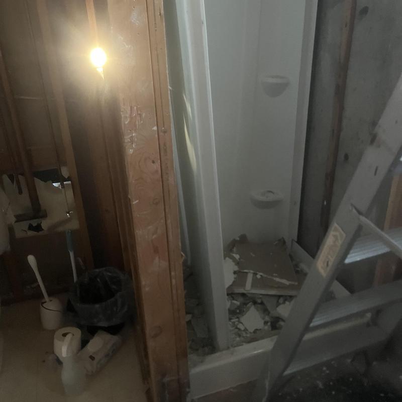 Bathroom shower demolition and framing with ladder