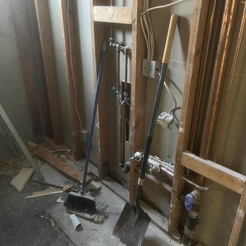 Sewer line plumbing rough-in with tools at job site