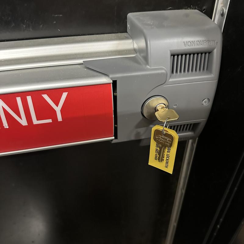 Commercial panic bar lock with rekeyed key inserted Commercial panic bar lock with rekeyed key inserted