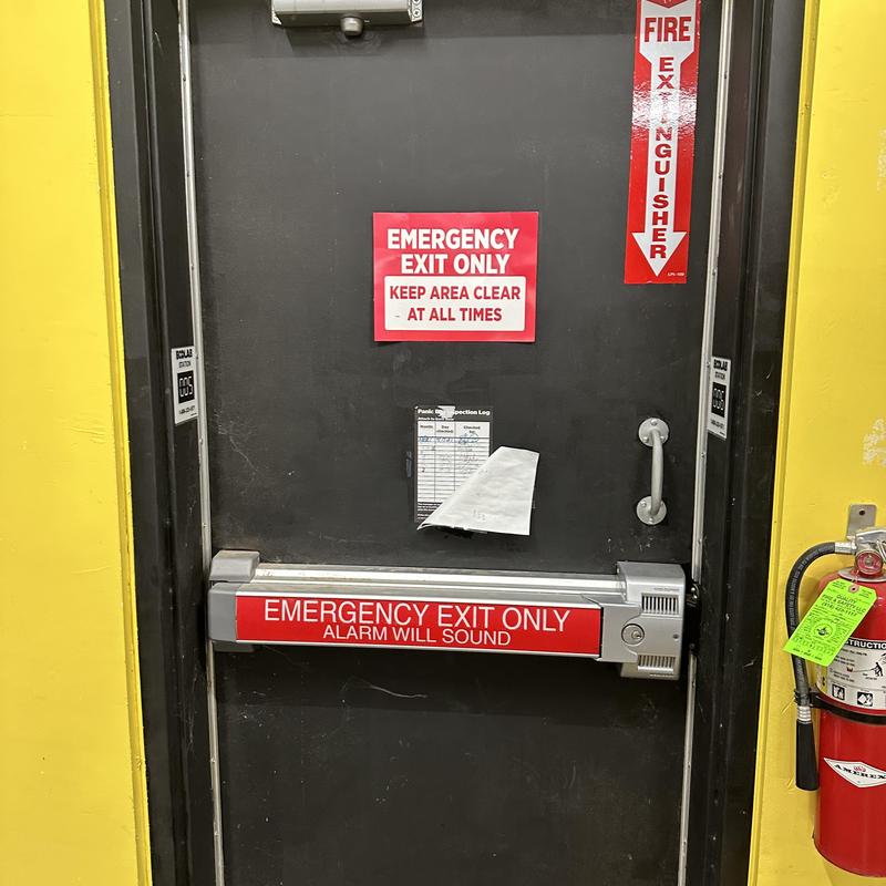 Alarmed commercial exit door with panic bar Alarmed commercial exit door with panic bar