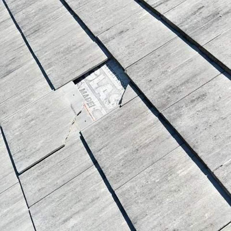 Roof tiles with a loose and damaged section in Cape Coral Roof tiles with a loose and damaged section in Cape Coral