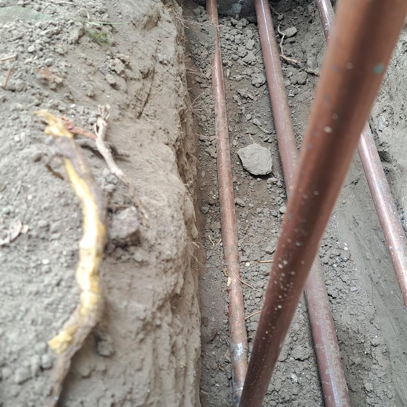 Copper gas and water lines installed in trench Copper gas and water lines installed in trench