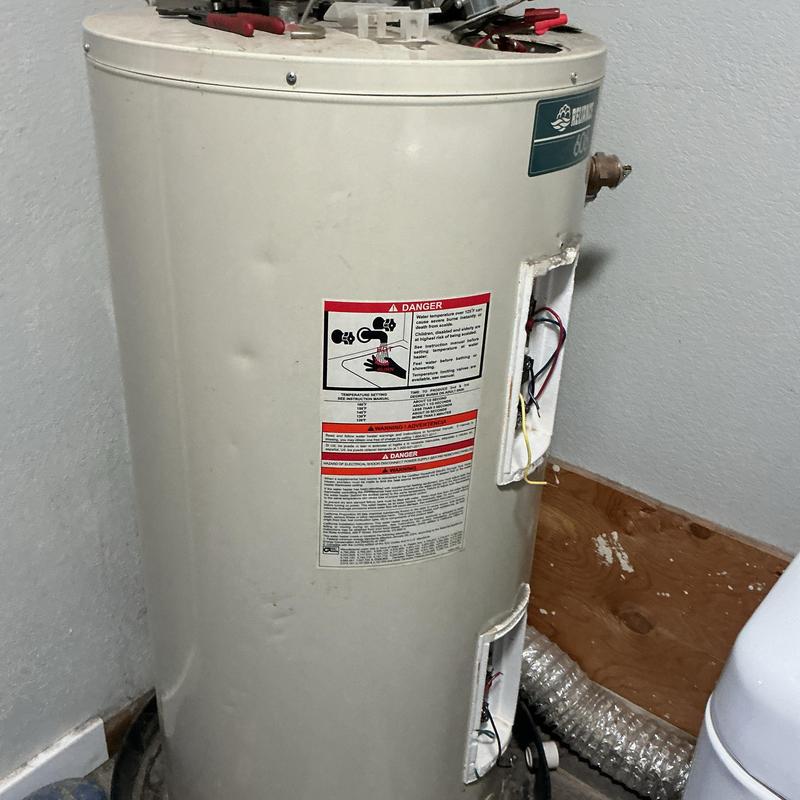 Electric water heater with wiring exposed for replacement Electric water heater with wiring exposed for replacement
