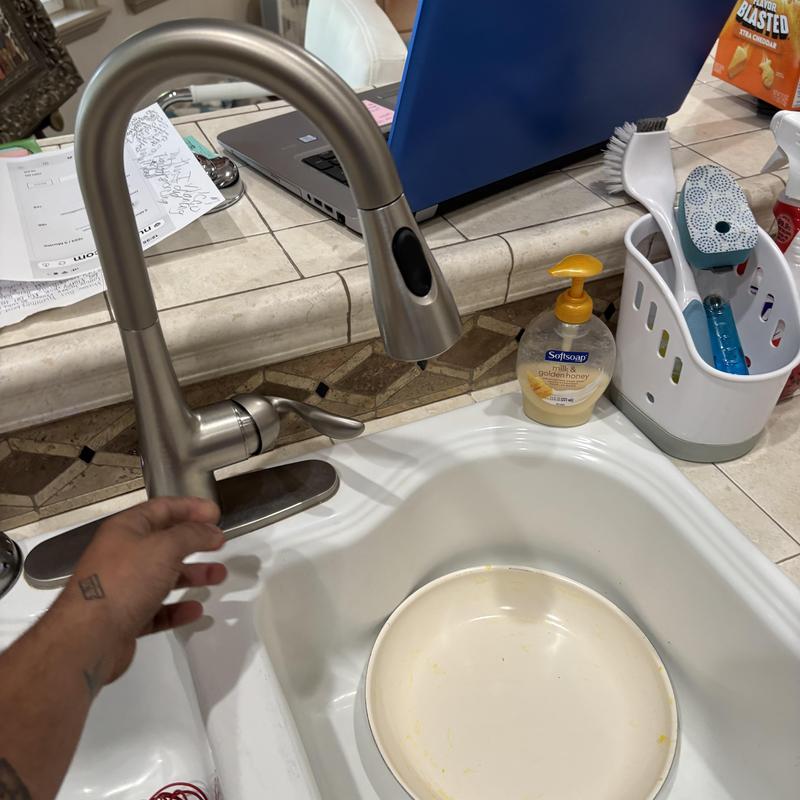 Touch kitchen faucet with battery replacement in sink