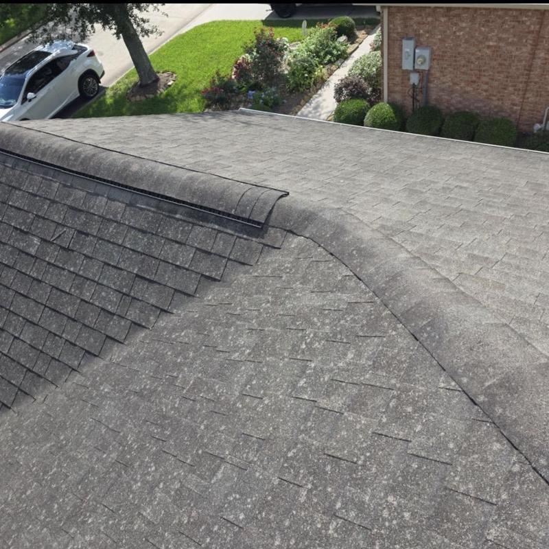 Asphalt shingle roof with hail damage inspection