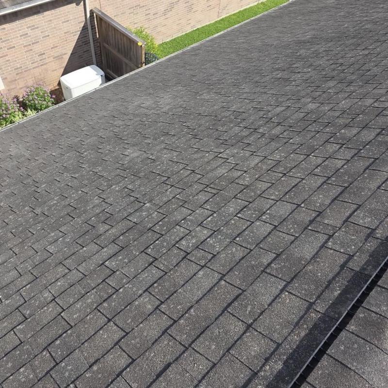 Asphalt roof shingles with minor hail damage spots