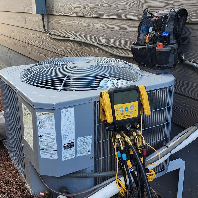 Carrier air conditioner with diagnostic gauges and tool bag