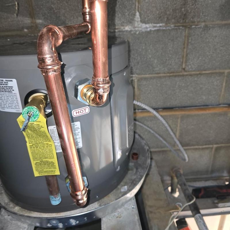Electric water heater with copper piping installation