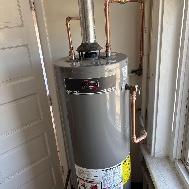 Gas water heater with copper piping and vent pipe Gas water heater with copper piping and vent pipe