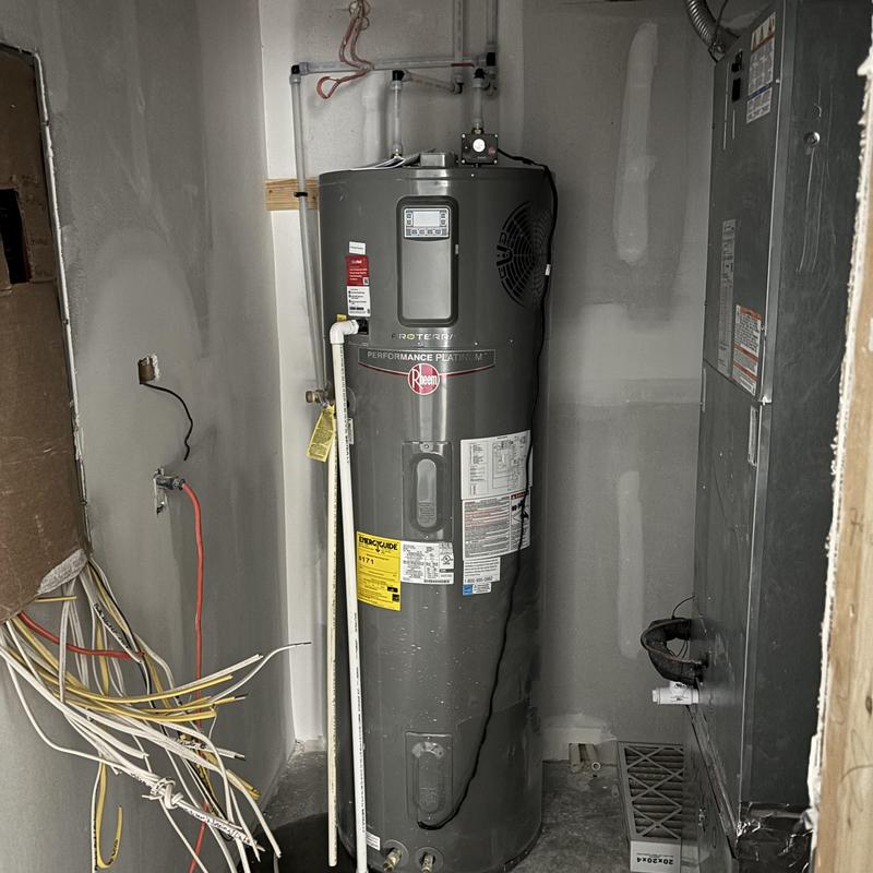 Geothermal water heater installation in utility room Geothermal water heater installation in utility room